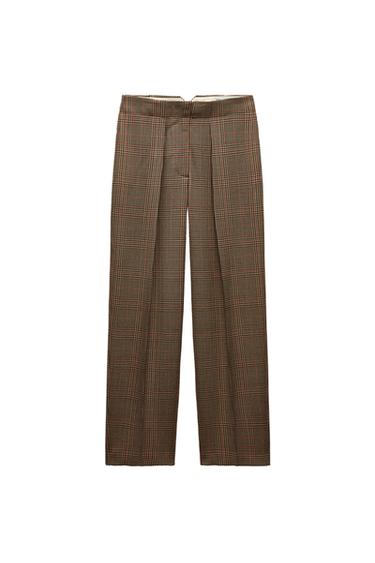 Front view of check trousers with front pleats.