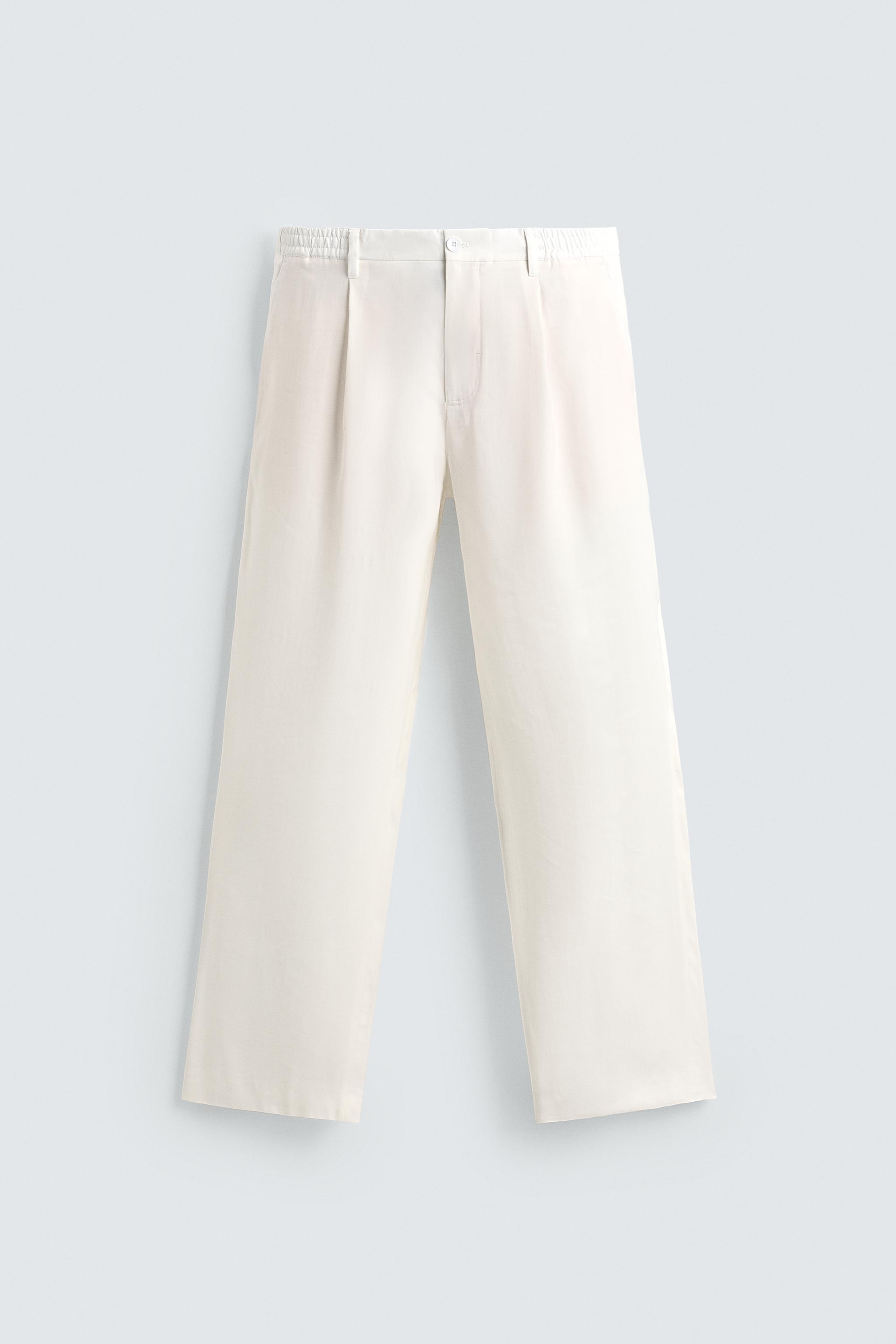 RELAXED FIT PLEATED PANTS