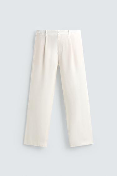 بنطلون فيت مريح بثنيات - أبيض الخاص بـ Zara