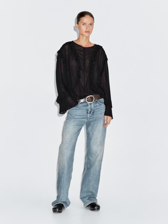 Flowing blouse with ruffles and zip