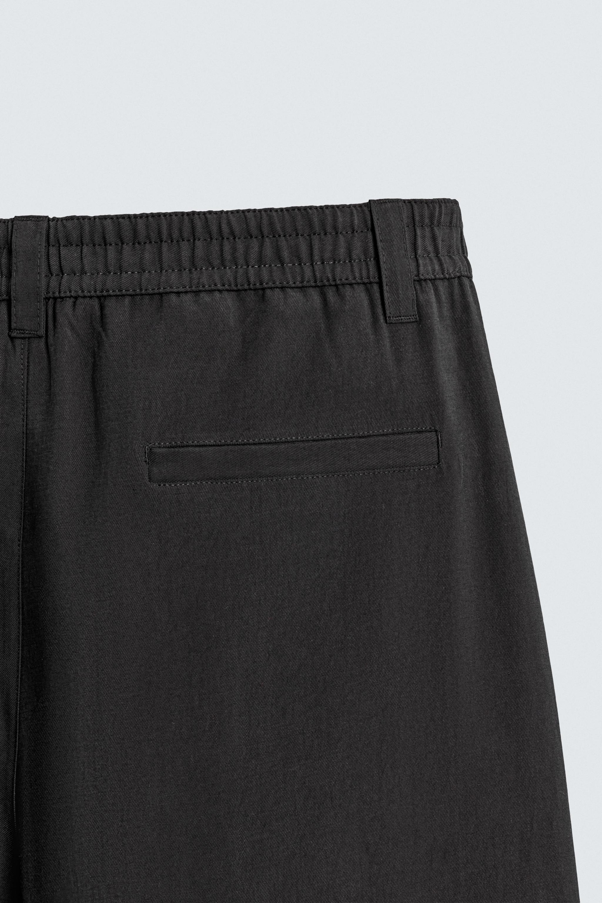 FLOWY PLEATED PANTS