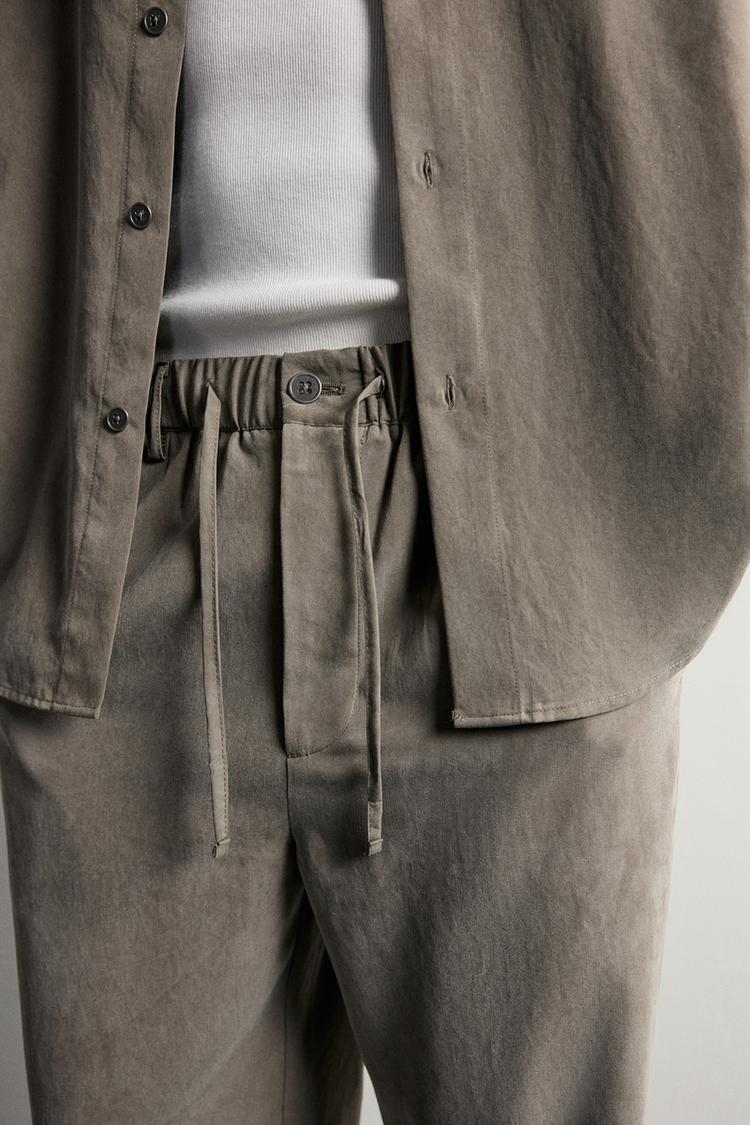 RELAXED FIT FLOWING TROUSERS