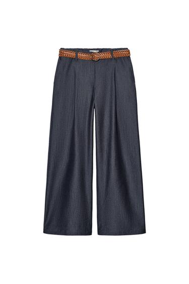 Front view of navy blue wide-leg trousers with a brown braided belt.
