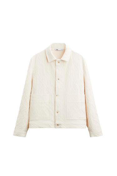 Front view of a white jacket with large front pockets and button fastening.