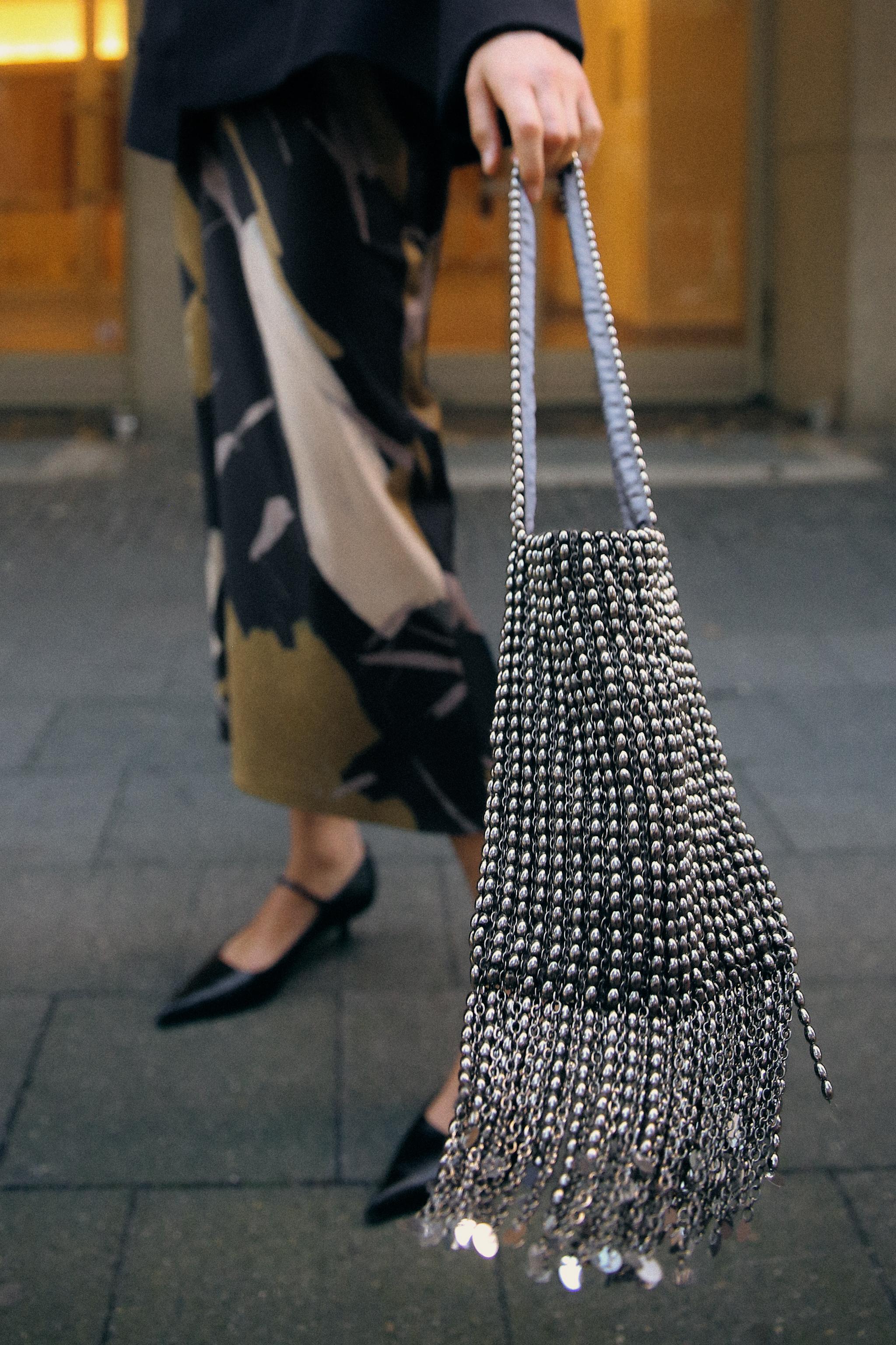 SHOULDER BAG WITH METAL APPLIQUES