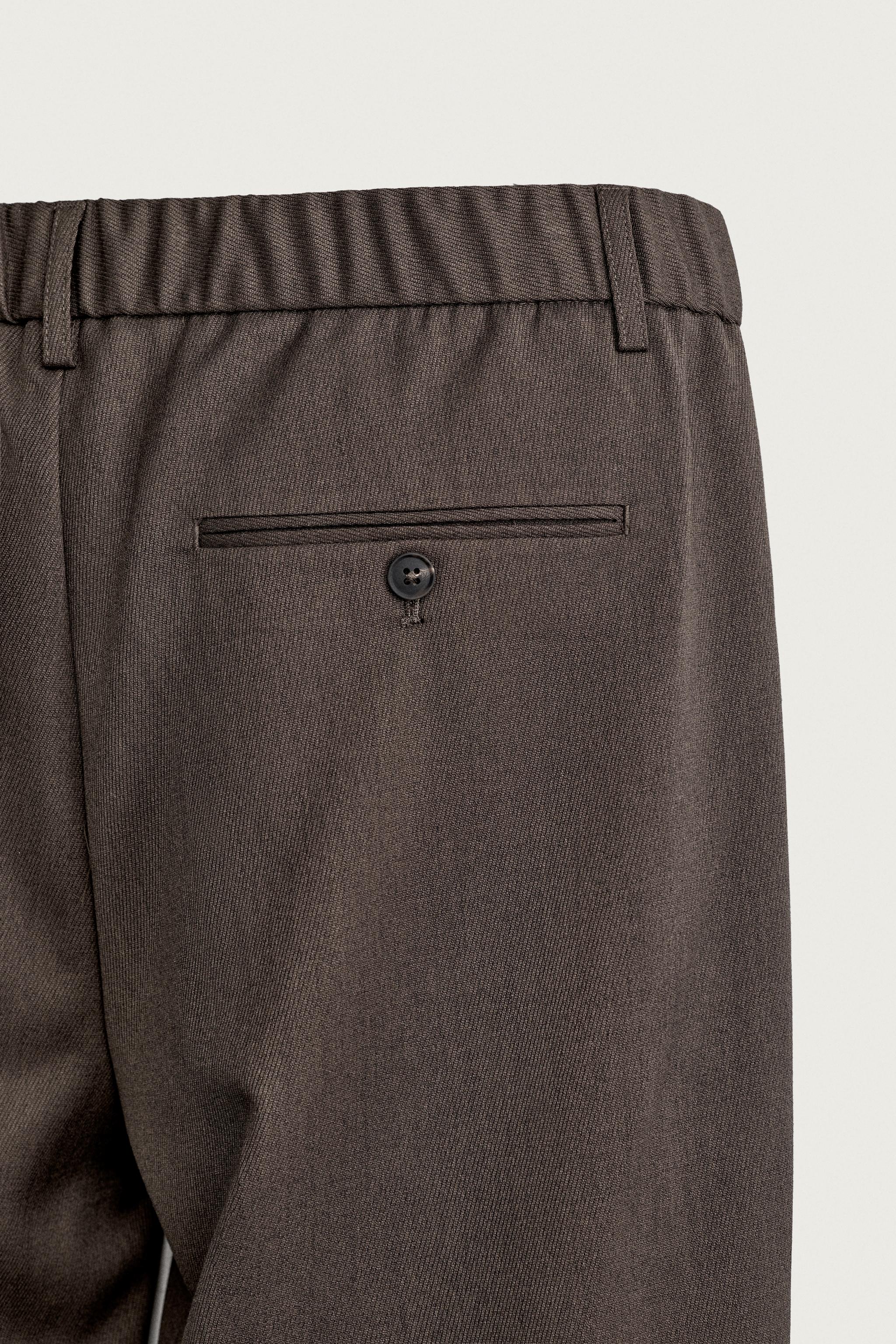SLIM FIT PLEATED PANTS