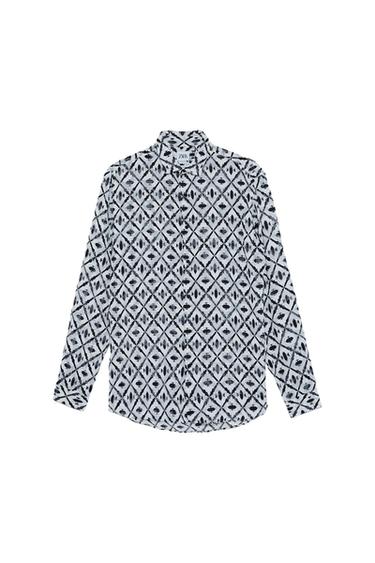 Front view of a black and white geometric print long-sleeved shirt.