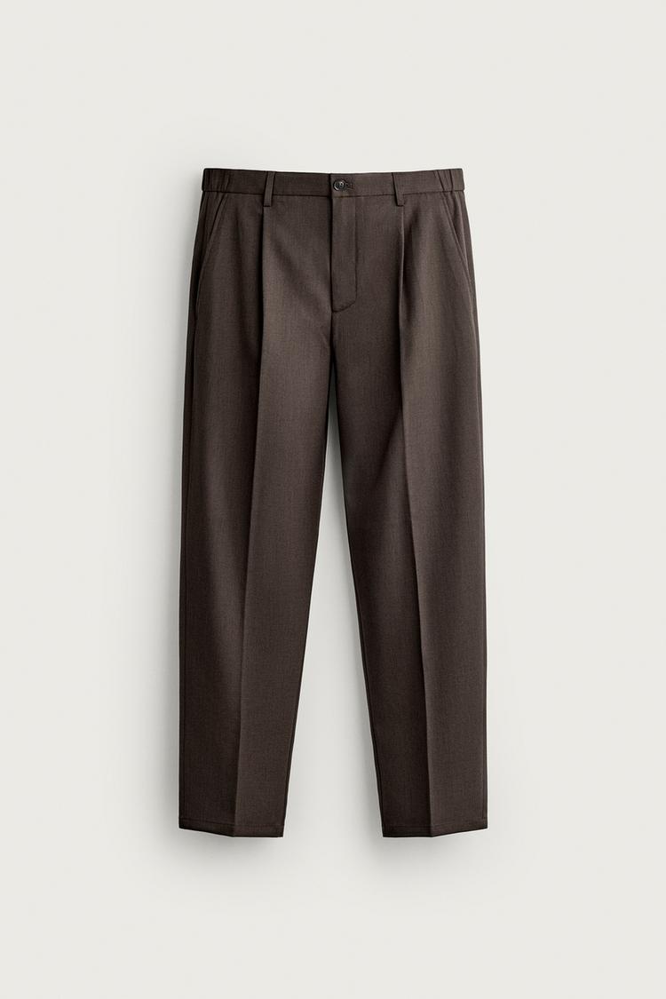 Pantalon slim fit pliegues