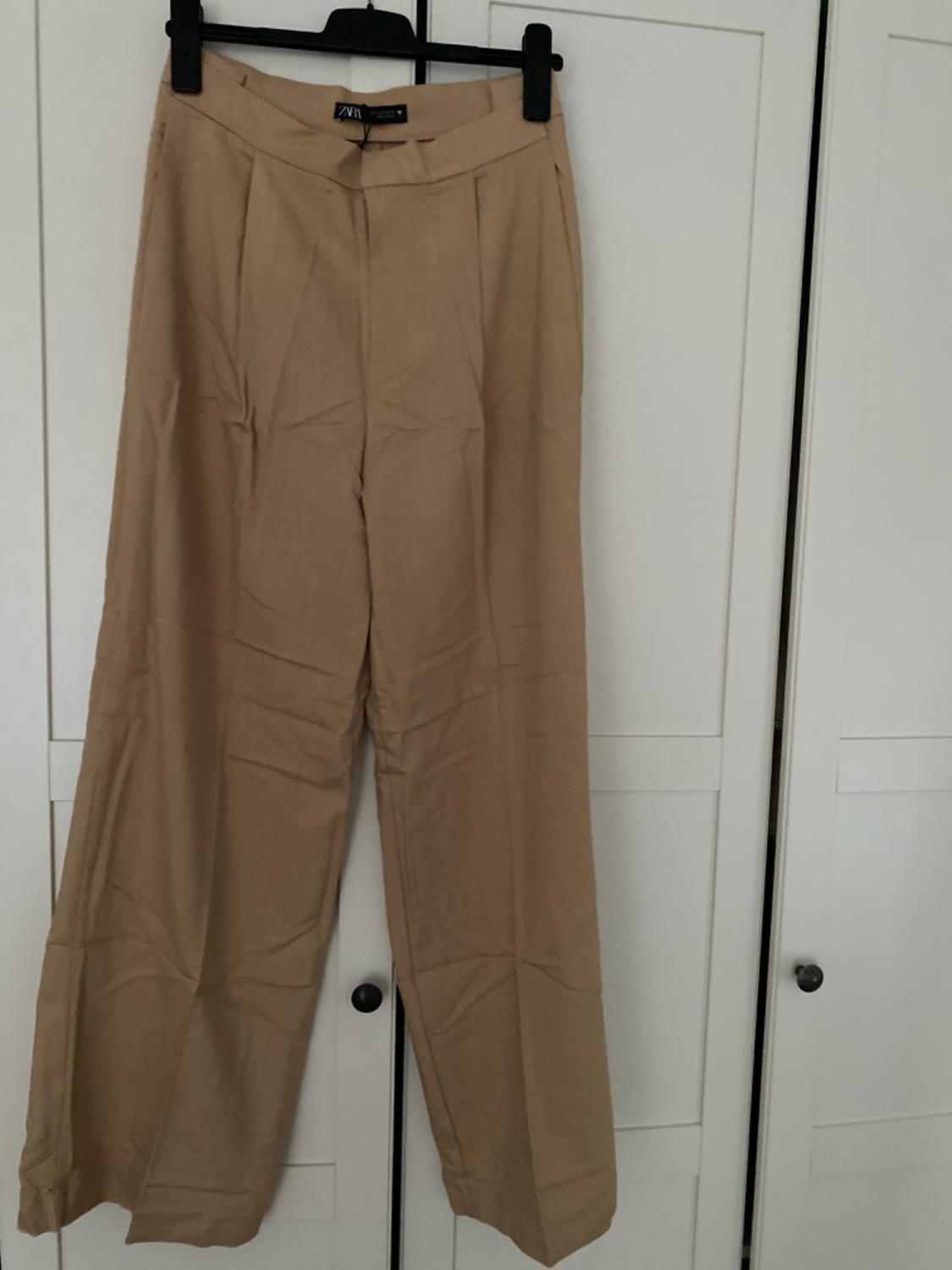 FULL-LENGTH PLEATED TROUSERS