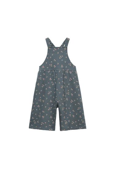 Front view of a blue floral print jumpsuit with straps.