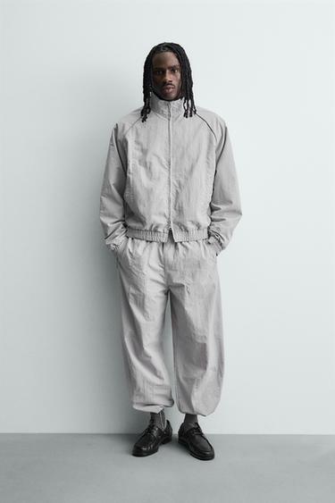 TECHNICAL JOGGING TROUSERS WITH CONTRAST SIDE TAPING - Light grey by Zara