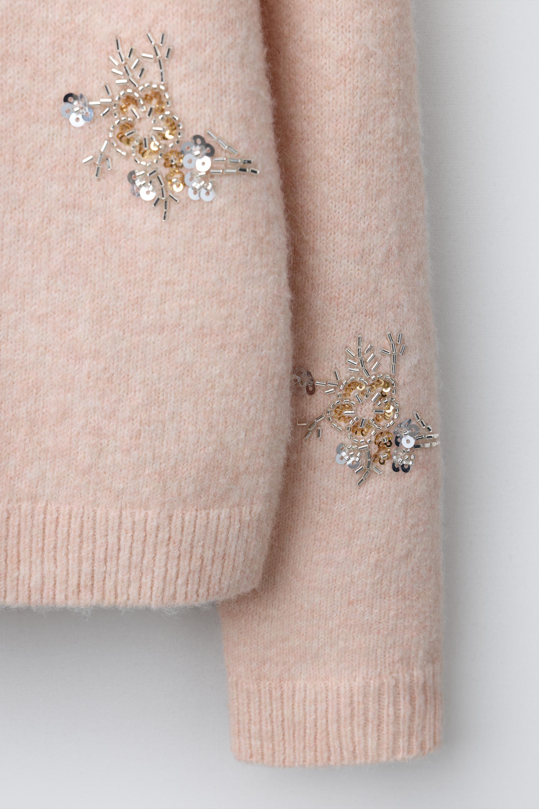 GILET EN MAILLE AVEC FLEURS FANTAISIE