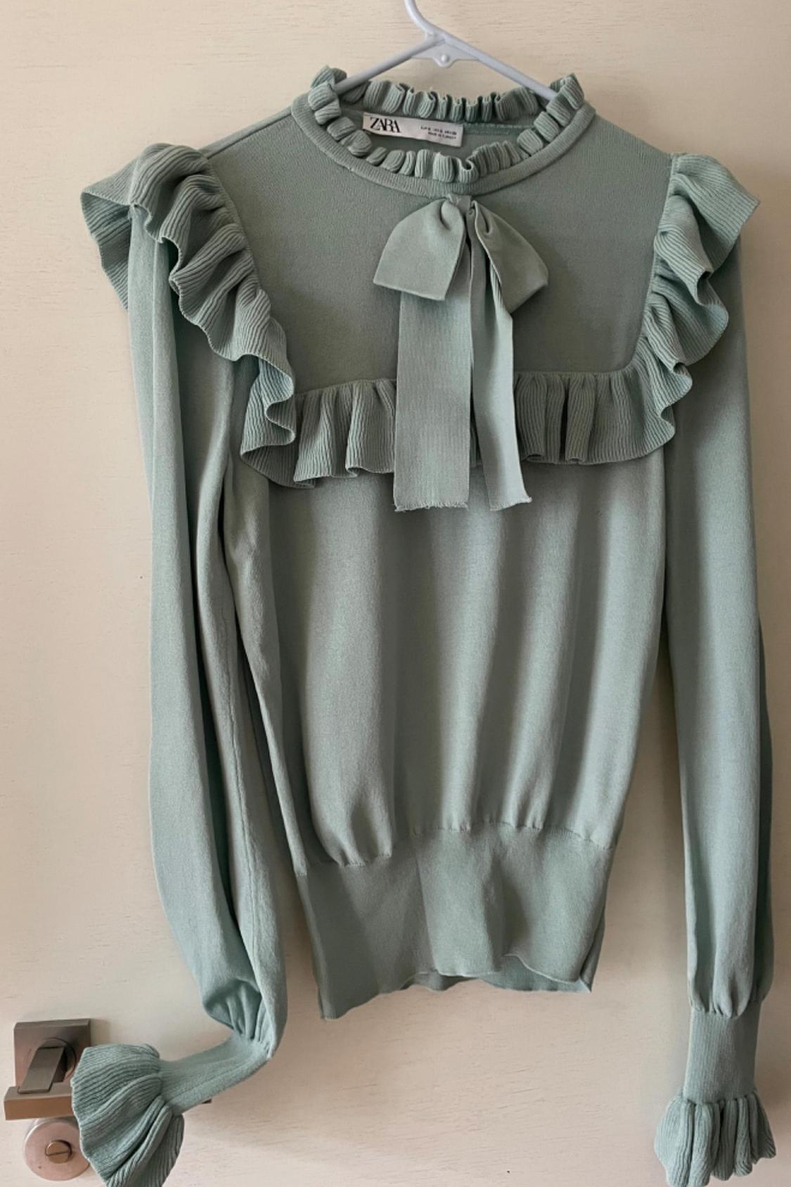 KNIT SWEATER WITH RUFFLES AND BOW