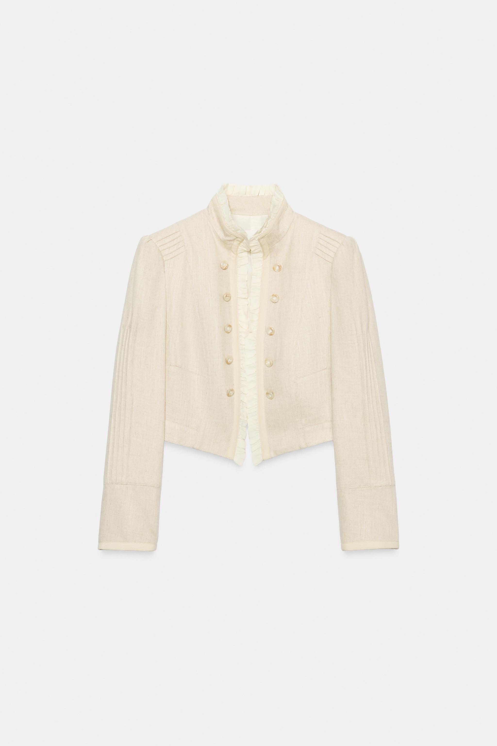 VESTE COURTE À VOLANTS