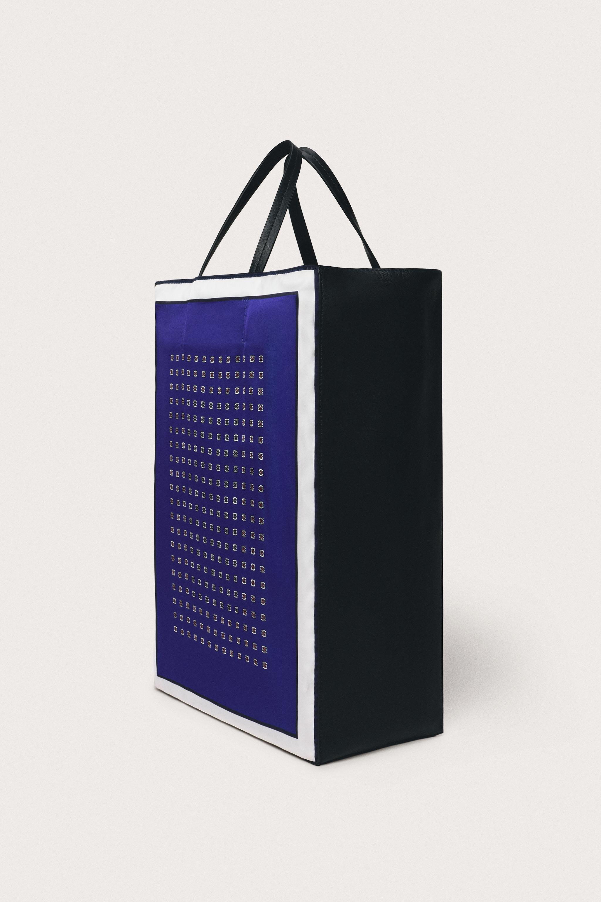 LIMITED EDITION LEATHER DETAIL HANDBAG