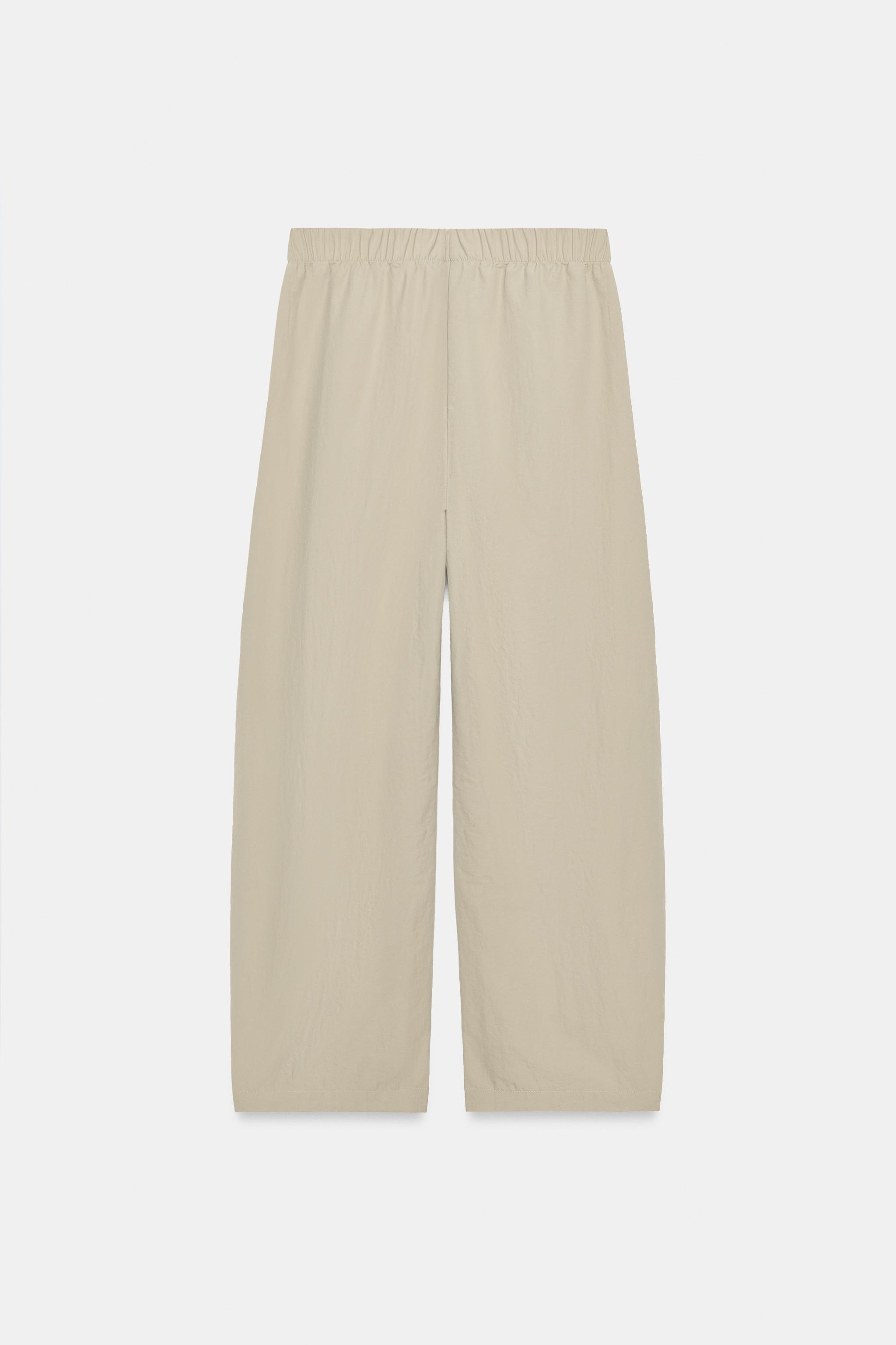 PANTALON EN TISSU TECHNIQUE ÉLASTIQUE