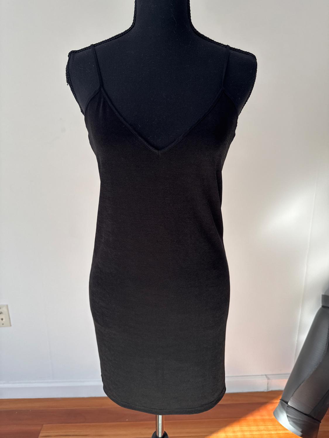 Front view of a black sleeveless V-neck dress