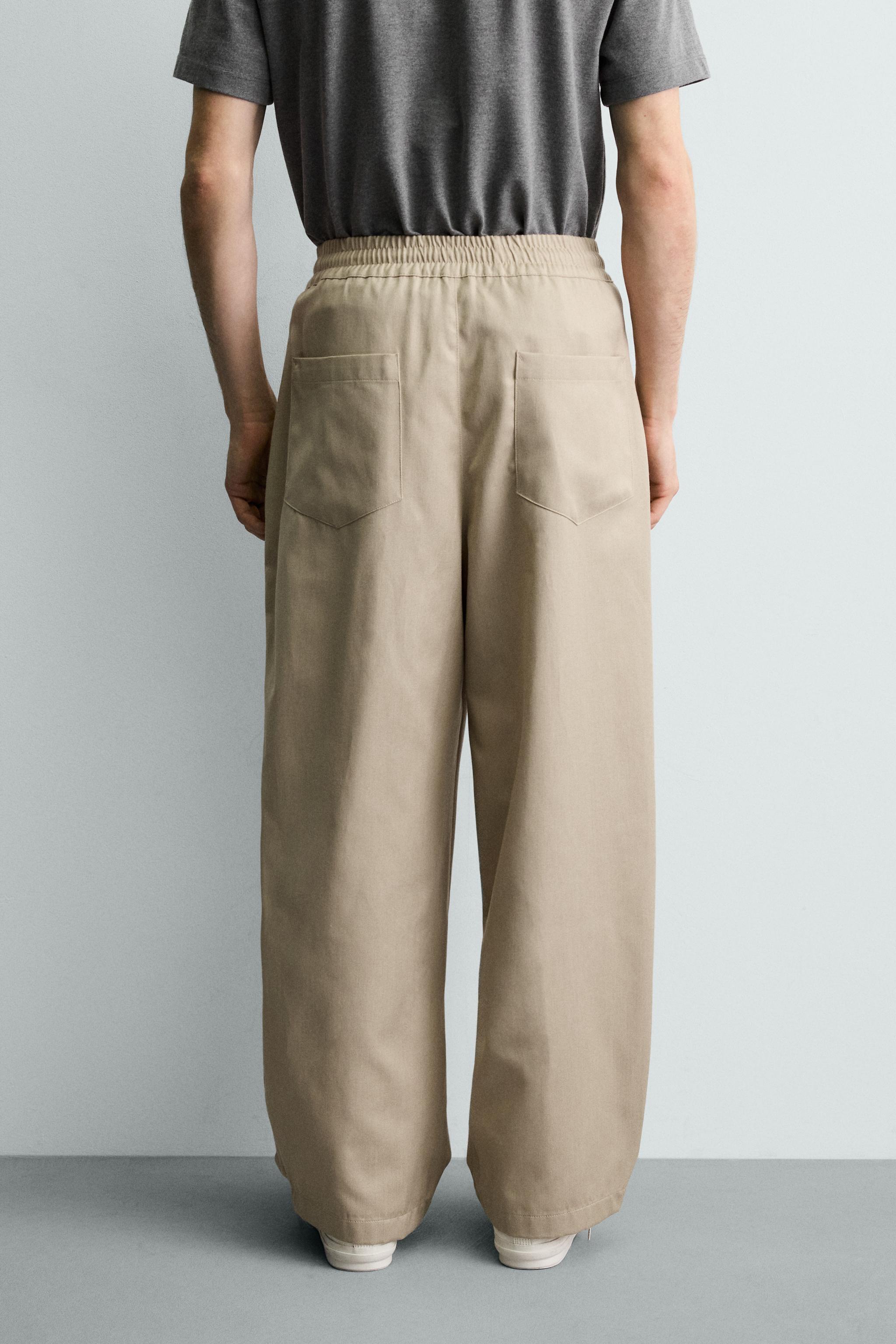 PLEATED BALLOON FIT PANTS