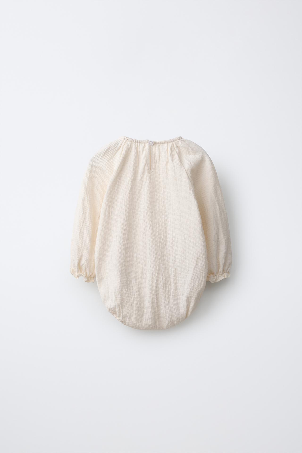 TEXTURED EMBROIDERED FLOWER BODYSUIT — Ecru