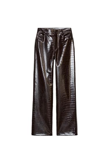 Front view of brown animal print faux leather trousers, high-waisted, straight leg, five pockets, zip and button fastening.