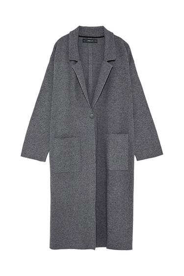 Front view of a grey coat with a lapel, one button, and large front pockets.