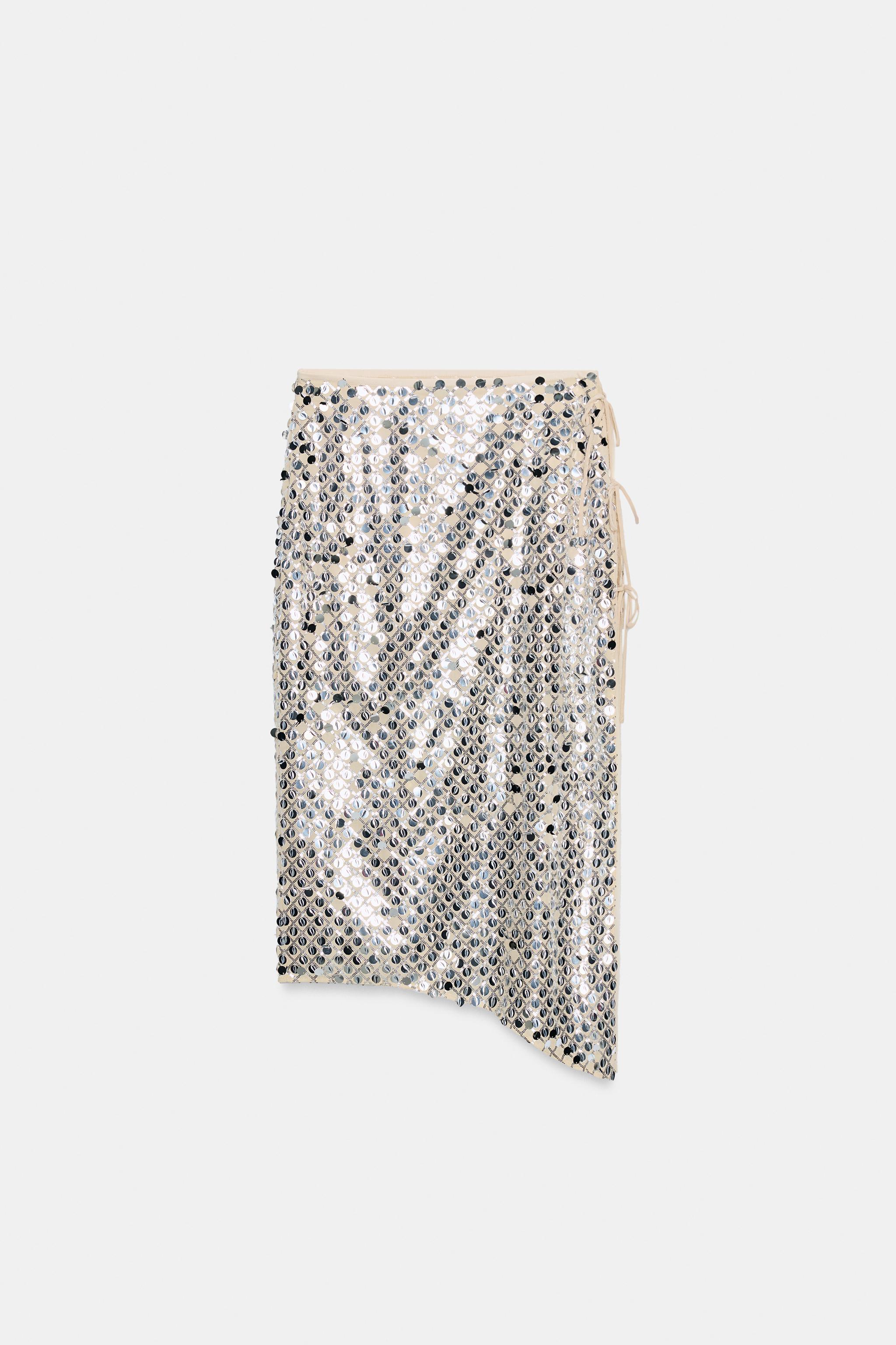 JUPE MI-LONGUE ASYMÉTRIQUE À PAILLETTES