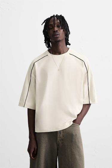 سويت شيرت ببييهات بلون متباين - أبيض مكسور الخاص بـ Zara