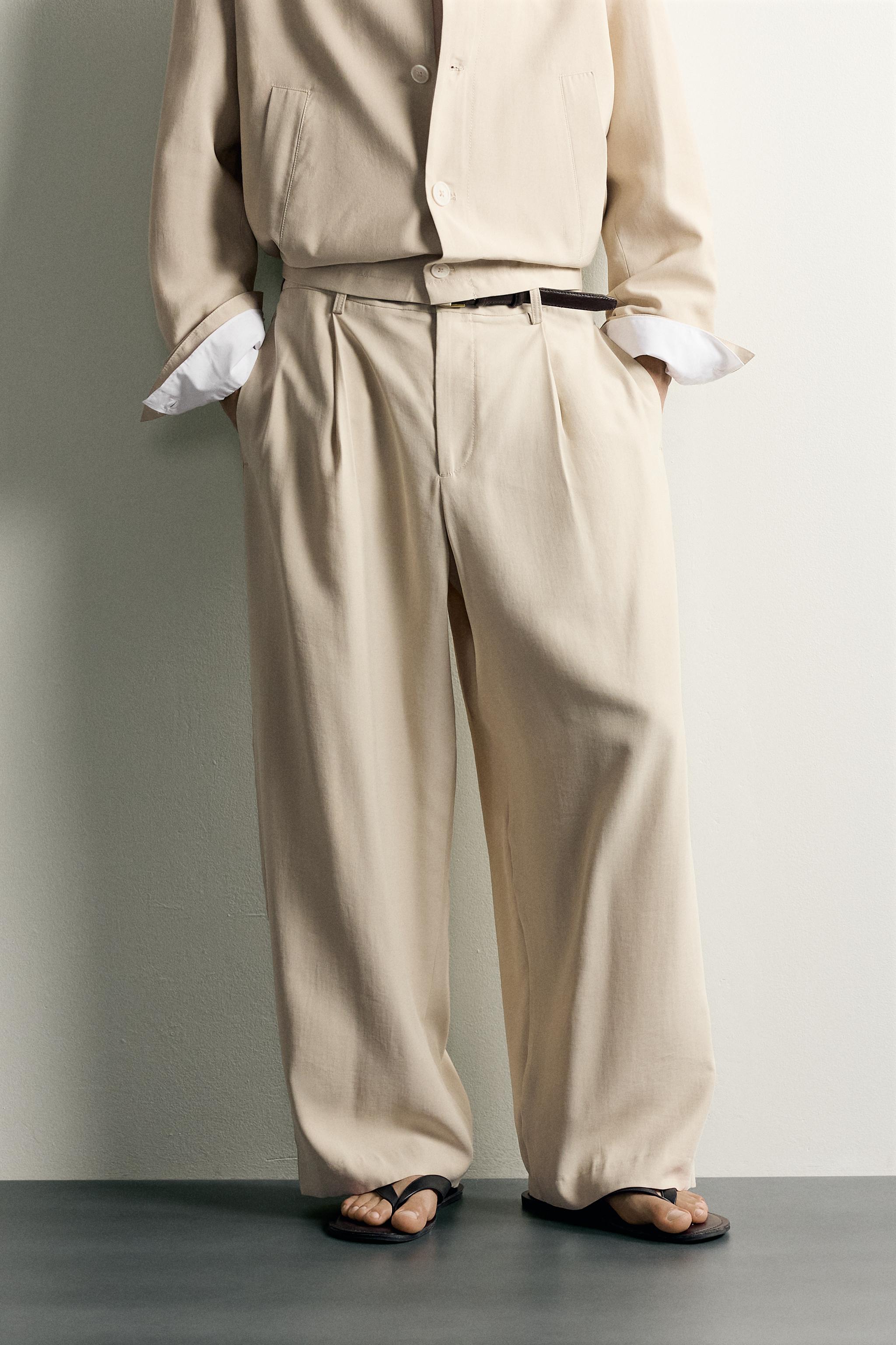 PLEATED RELAXED-FIT TROUSERS