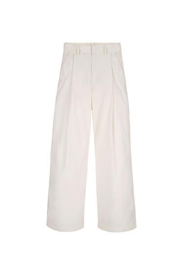 Front view of white wide-leg trousers with side pockets.