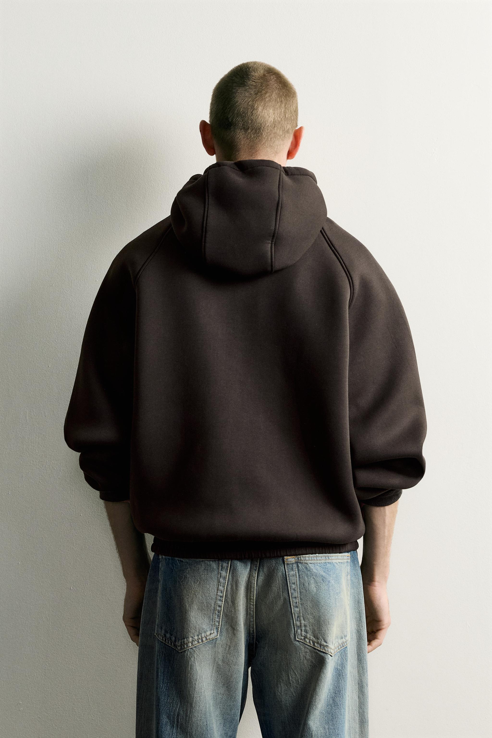 VESTE TECHNIQUE À CAPUCHE RELAXED FIT
