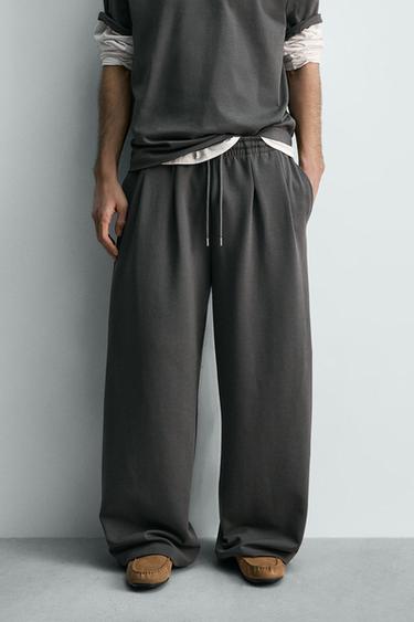 بنطلون رياضي بقصة واسعة من نسيج INTERLOCK - رمادي داكن الخاص بـ Zara