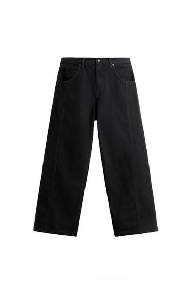 Front view of wide black pants with side pockets.