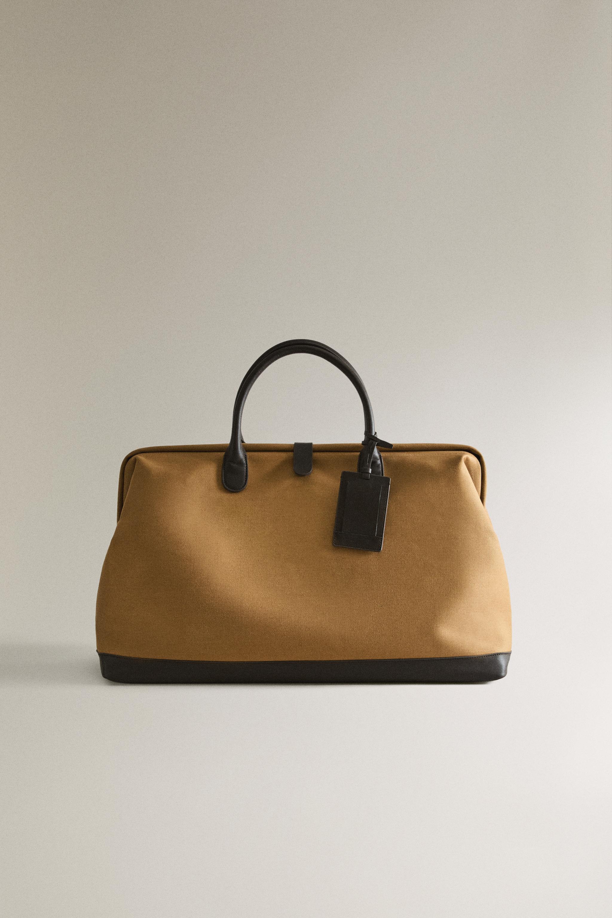 COTTON TRAVEL BAG WITH BUTTON CLOSURE