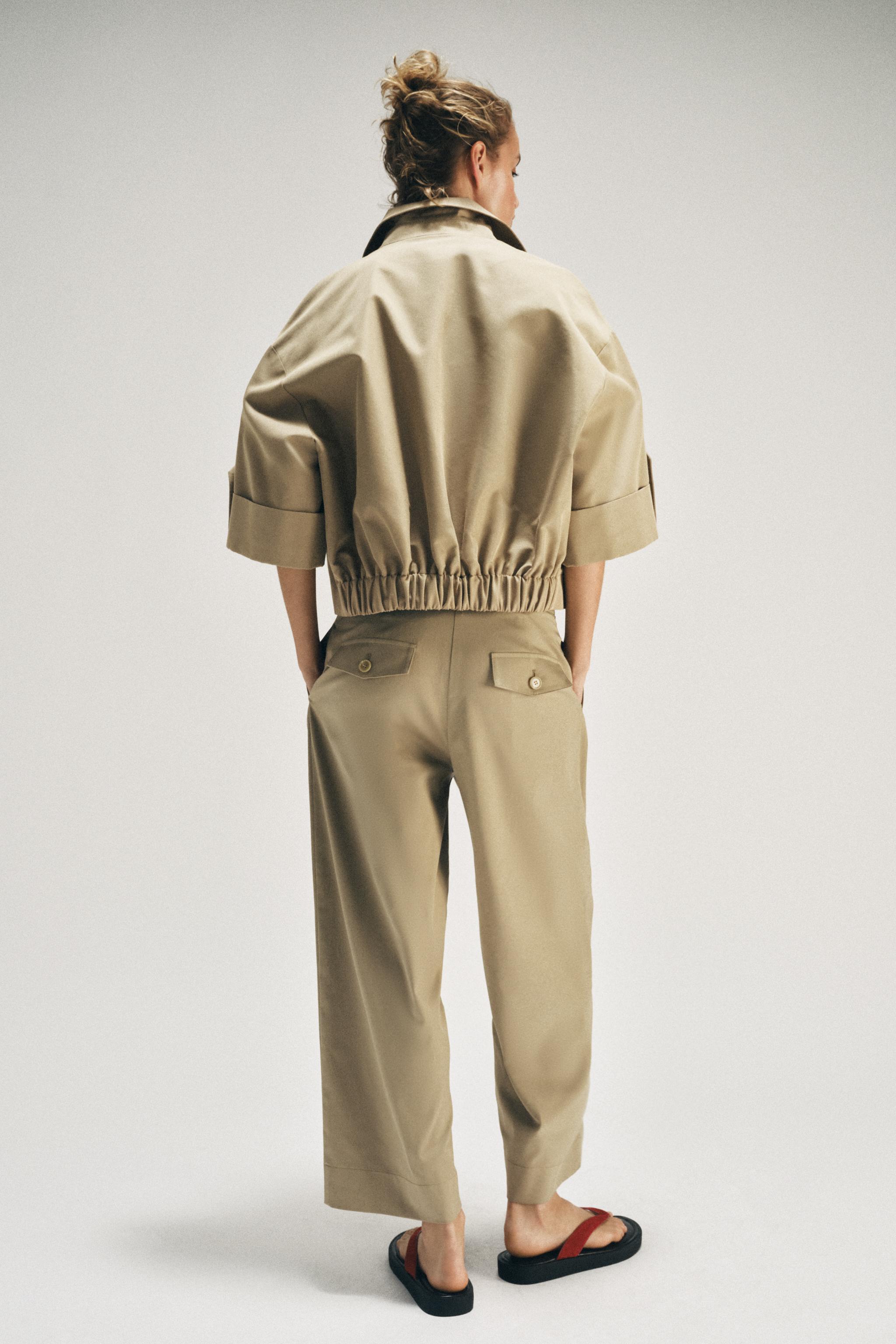 SHORT TRENCH WITH ROLLED SLEEVES