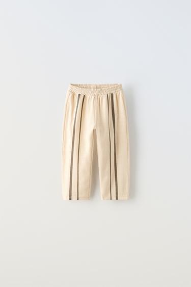 БРЮКИ В КОНТРАСТНУЮ ПОЛОСКУ — ЭКРЮ от Zara — изображение 0
