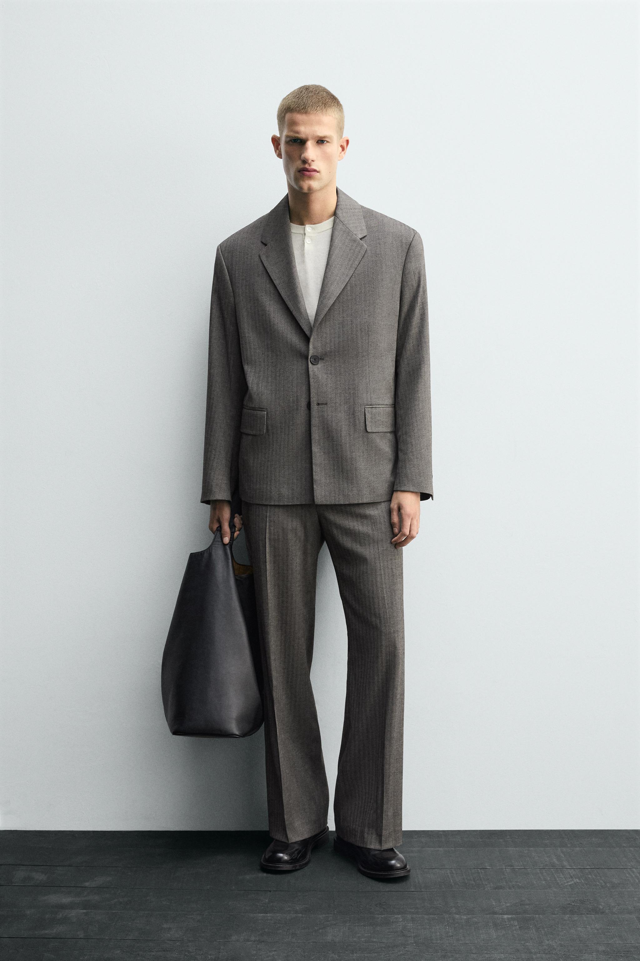 HERRINGBONE SUIT FLARE FIT PANTS