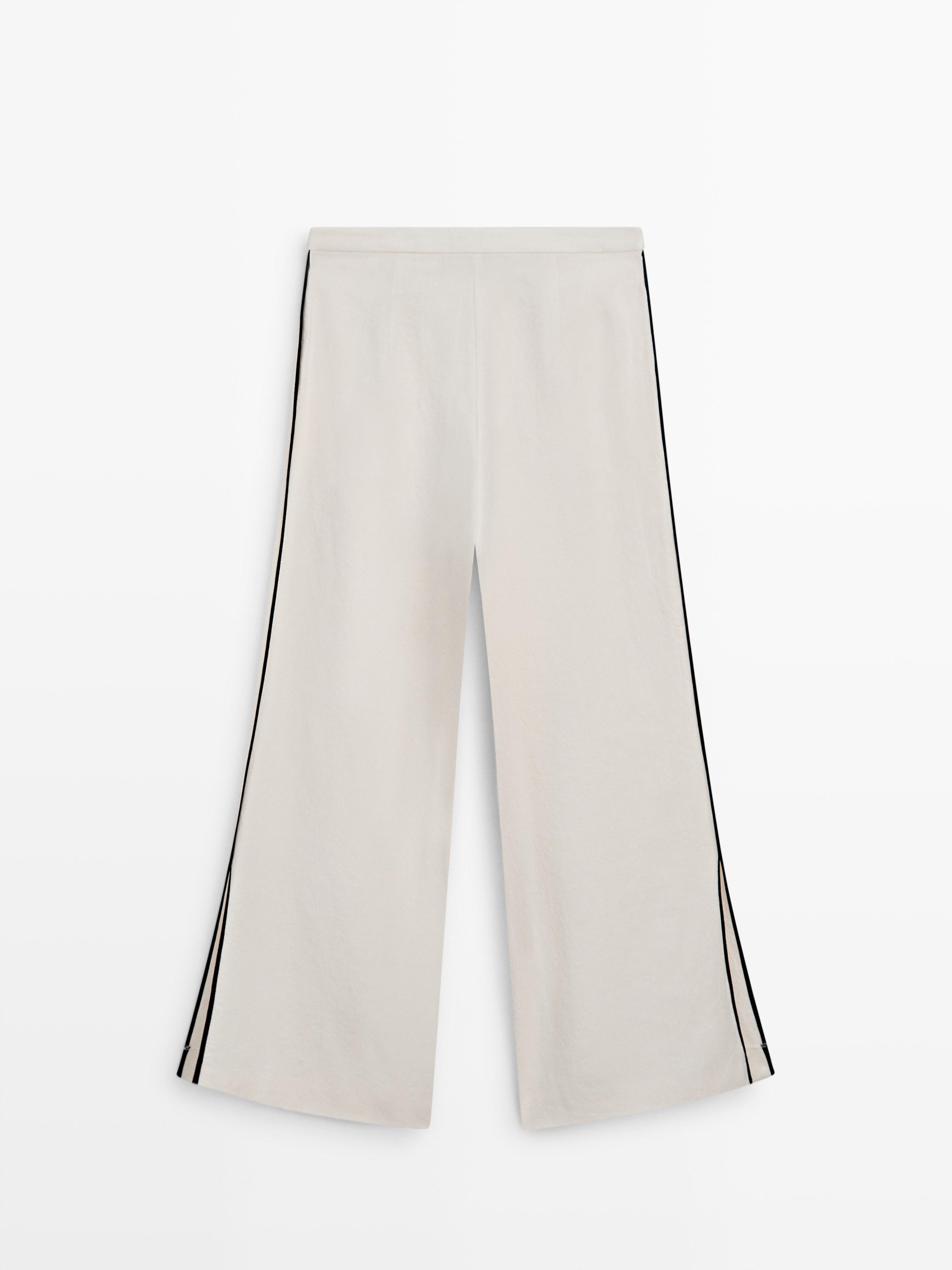Linen trousers with contrast piping
