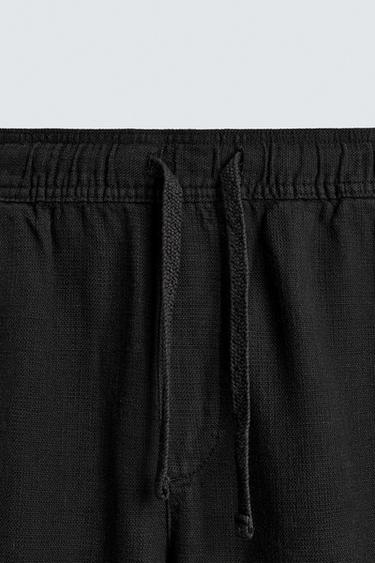 PANTALÓN RELAXED FIT ESTRUCTURA - Negro de Zara
