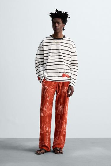 Zara GRAPHIC PRINT KNIT PANTS © OTIS KWAME KYE QUAICOE - Red - Image 0