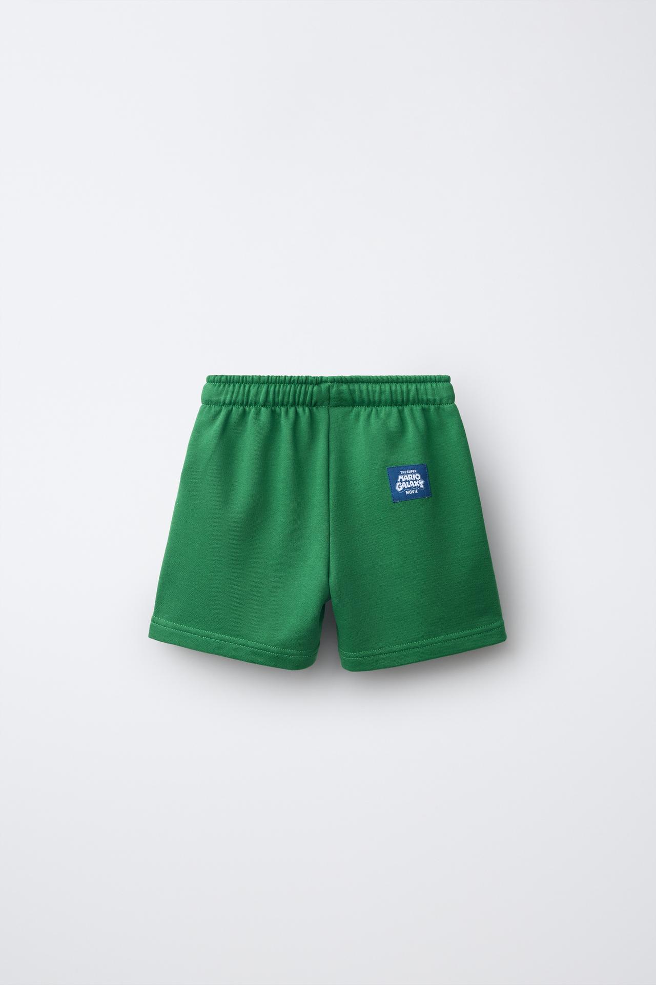MARIO BROS.™ © NINTENDO PRINT BERMUDA SHORTS — Green