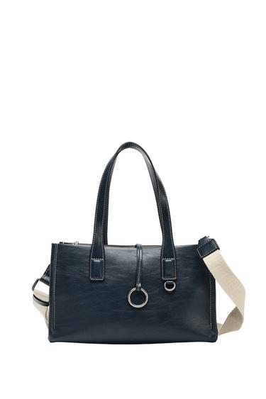 Front view of black handbag with double handles, adjustable beige strap and metal ring details.