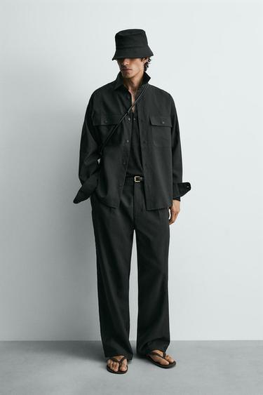 מכנסיים נשפכים עם קפלים - שחור של Zara