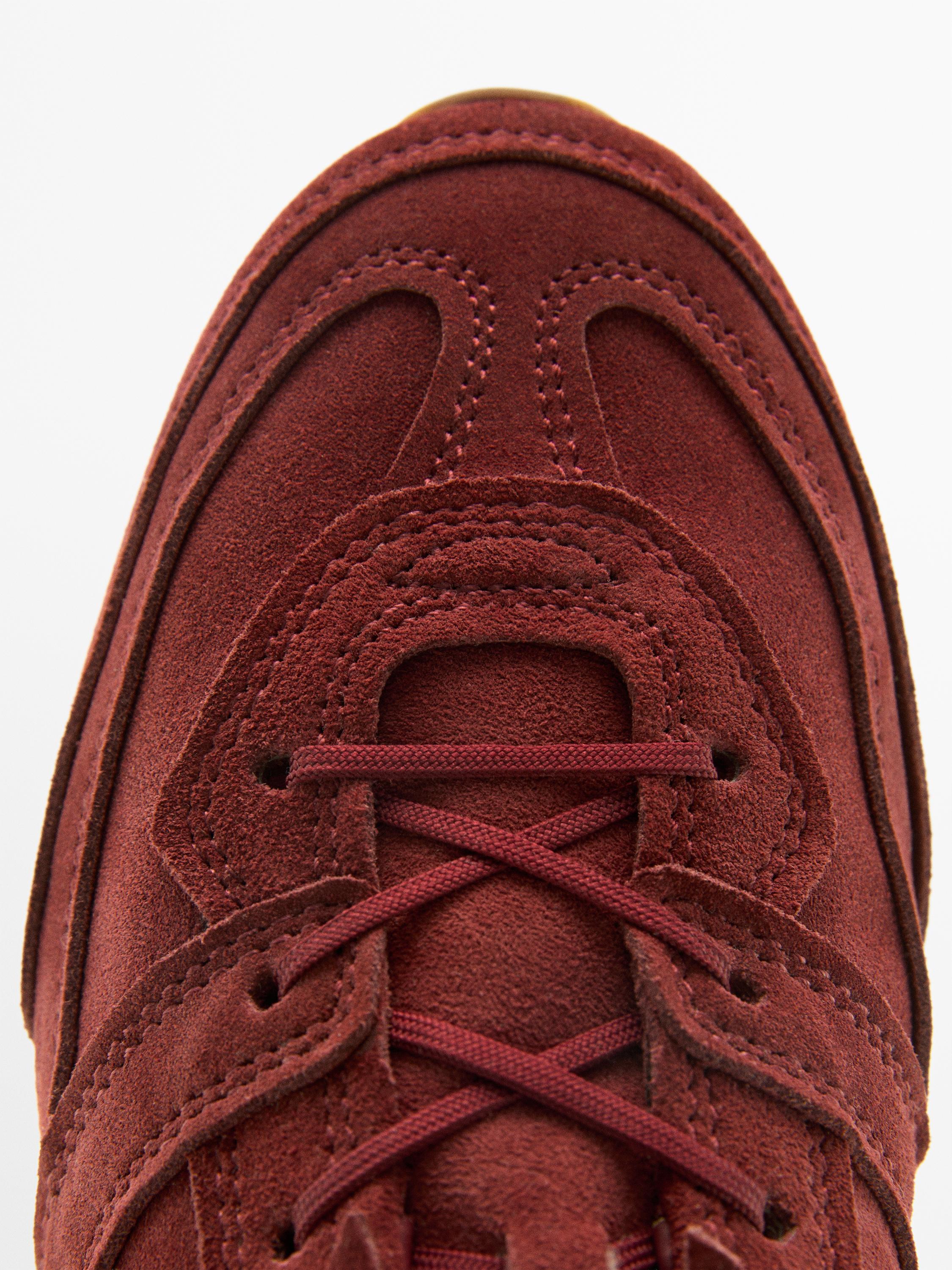 Split leather trainers with piece details