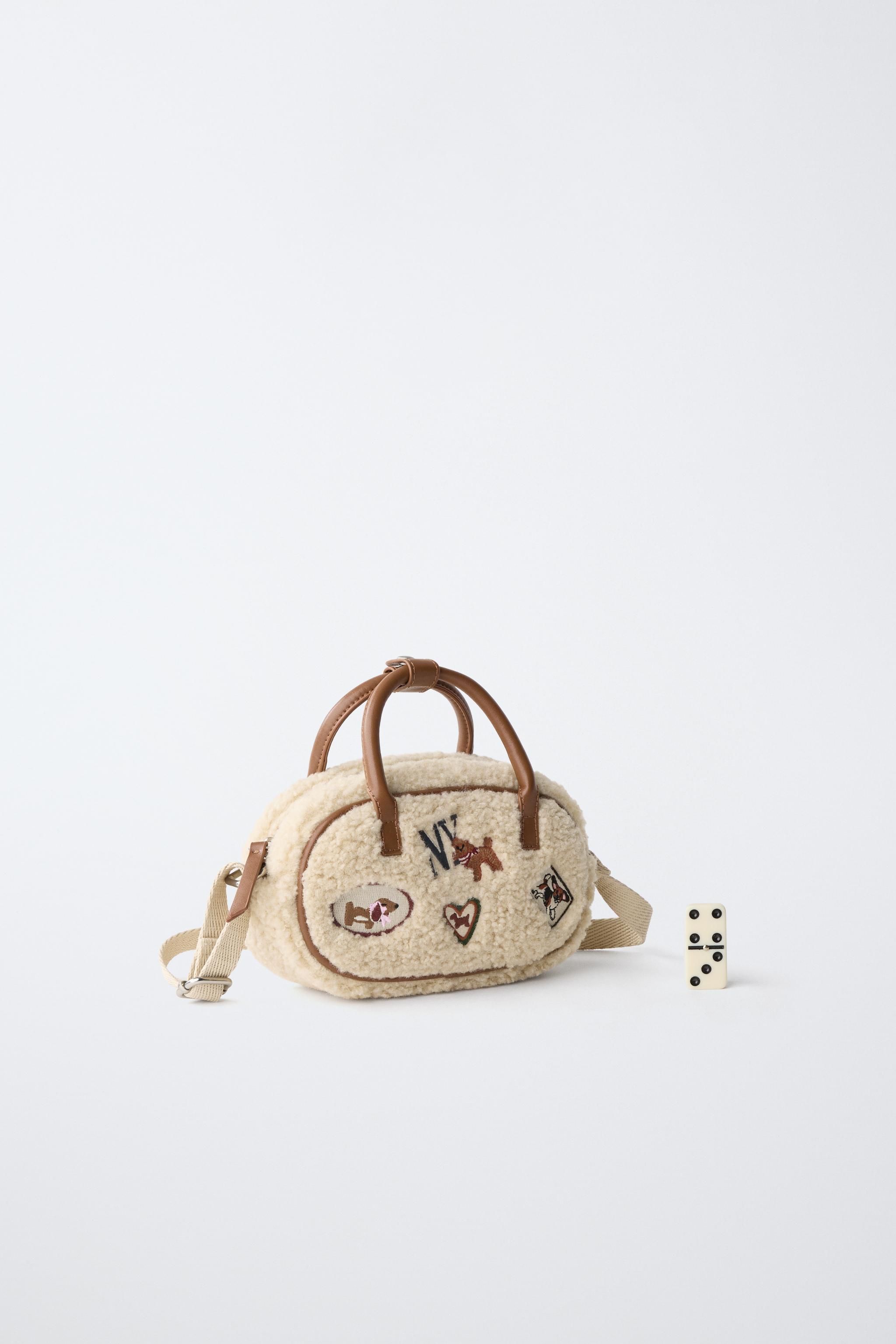 SAC BANDOULIÈRE EN MOUTON RETOURNÉ AVEC PIÈCE