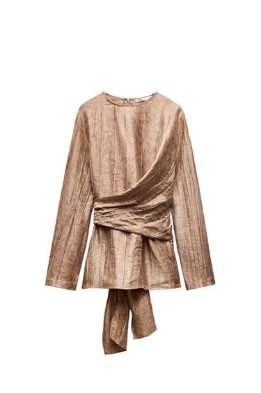 Front view of a brown blouse with pleats and a tied belt.