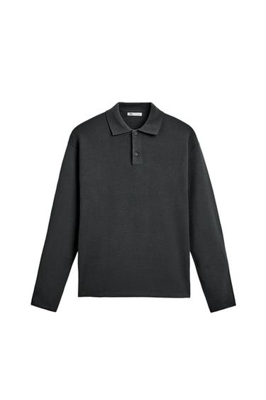 Front view of a black, long-sleeved polo shirt with a classic collar and button fastening.