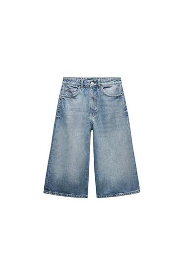 Front view of blue denim shorts with front pockets.