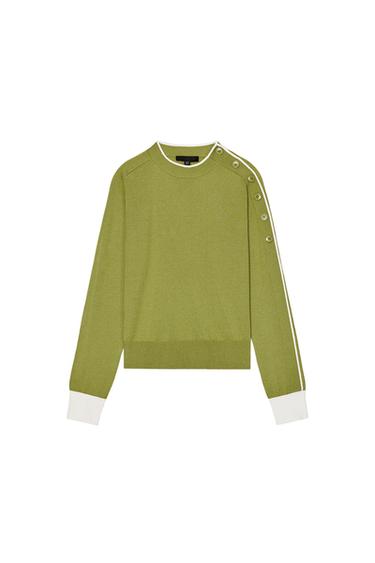 Front view of a green jumper with buttons on the shoulder and white cuffs.