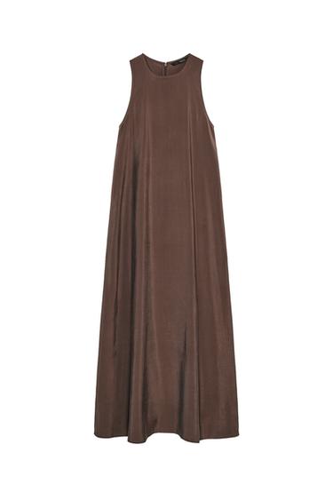 Front view of a long, loose, sleeveless brown dress