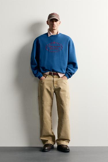 SUDADERA RELAXED FIT BORDADOS COMBINADOS - Azulón de Zara - Imagen 0